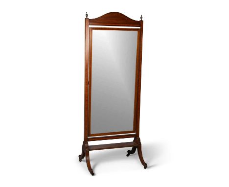 AN EDWARDIAN INLAID MAHOGANY CHEVAL MIRROR with brass urn-form finials, the downswept legs terminating in square brass caps a