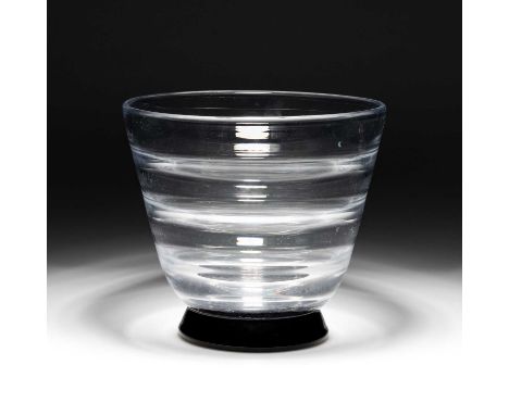 SIMON GATE FOR ORREFORS, AN OPTIC BLOWN VASE WITH BLACK GLASS BASE, CIRCA 1930S signed. 21.5cm highMarks and scratches to the