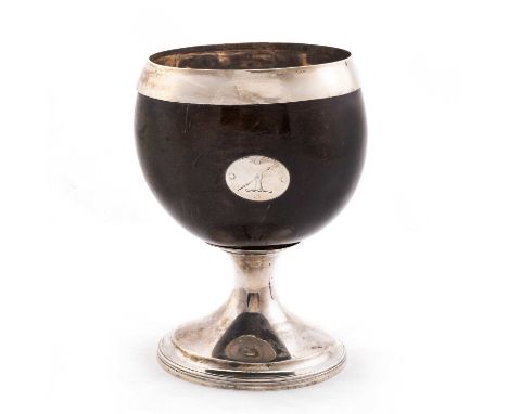 A GEORGE III SCOTTISH SILVER-MOUNTED COCONUT CUP  by P Cunningham & Son, Edinburgh 1810, with applied crested oval reserve an