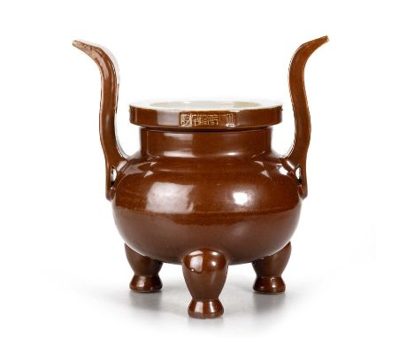 A CHINESE AUBERGINE-GLAZED TRIPOD CENSER impressed characters to the side of the rim. 29.5cm high