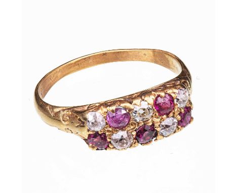 A RUBY AND DIAMOND RING marks rubbed, set with two rows of alternating round-cut and old-cut rubies and diamonds. Ring size L