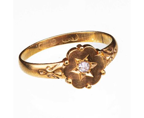 A VICTORIAN STYLE YELLOW GOLD AND DIAMOND RING the head stamped '15ct' and the shank '9ct', the shaped circular head star-set