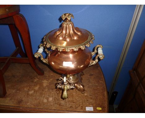 Large and orante copper samovar hot water urn with embossed detail with ceramic handles