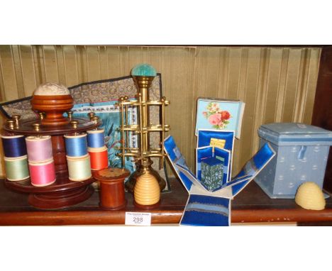 Sewing items including bobbin and thread holders, and a 1920's silk needlecase and needle holder with contents