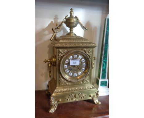 19th c. French ormolu mantle clock having brass dial with enamel numerals