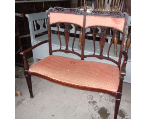 Edwardian carved mahogany upholstered two seater sofa