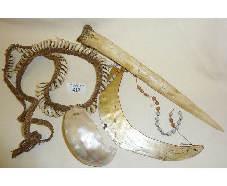 Tribal Art shell and nut jewellery and a carved bone tool