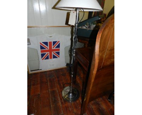 A French style chrome and plated tubular standard lamp. 
