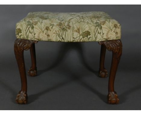 A George II style carved walnut dressing stool, having a foliate tapestry woven stuff over seat, raised on acanthus leaf carv