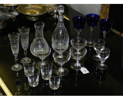 A collection of modern glass ware, to include a set of champagne flutes and decanter, another decanter with stoppers and etch