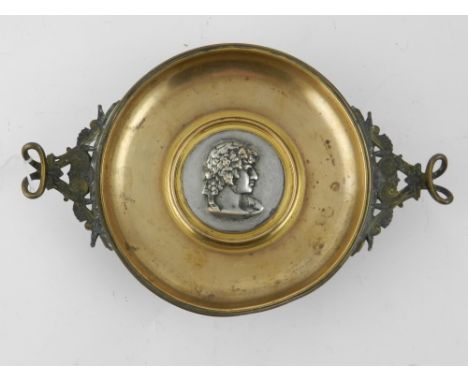 A 19th century bon bon dish, raised on a circular base, having scrolling foliate, twin handles, having portrait study of a ma
