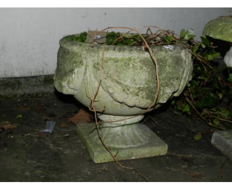 A stone planter, raised on a square base H.35cm