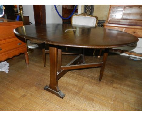 Ercol,England. A drop leaf table with out swept legs. 71cm x 34 cm (extended)