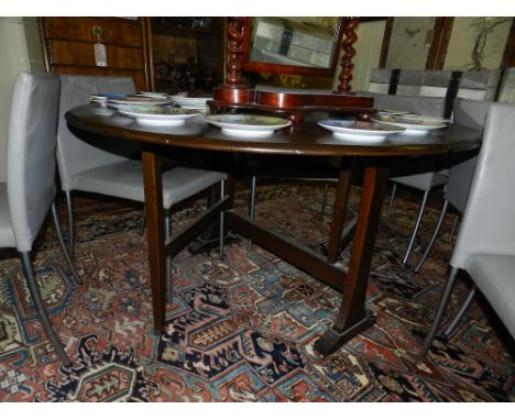 An Ercol golden elm oval coffee table H.44cm W.100cm