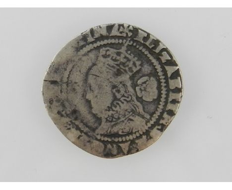 An Elizabeth I three pence coin, dating to 1577, bears portrait of Elizabeth I on one side and coat of arms to the other
