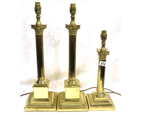 Pair of modern brass columnar table lamps, H: 53 cm, with a further smaller example. P&P Group 3 (£25+VAT for the first lot a