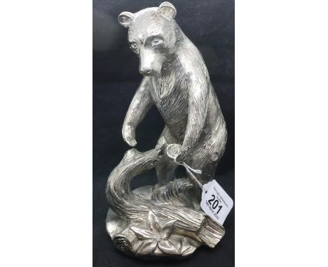 A large silver coated bear figurine, stamped AG Laminato, H: 24 cm. P&amp;P Group 2 (£18+VAT for the first lot and £3+VAT for