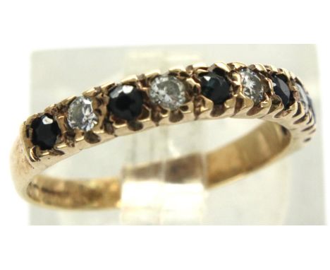 9ct gold sapphire and clear stone half eternity ring, size I/J, 1.4g. P&amp;P Group 1 (£14+VAT for the first lot and £1+VAT f