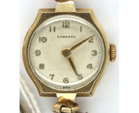 Garrard; 9ct gold cased ladies wristwatch on a rolled gold bracelet, not working at lotting. P&amp;P Group 1 (£14+VAT for the