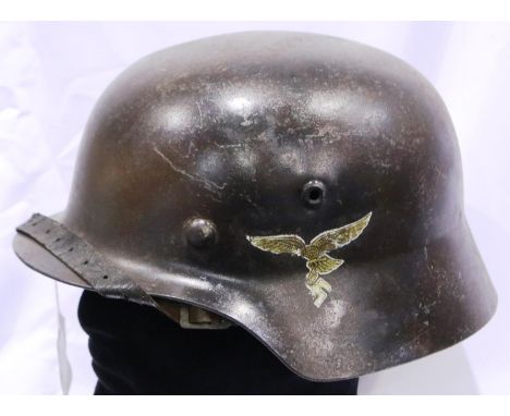 German WWII Luftwaffe steel helmet with single decal and leather liner. P&amp;P Group 2 (£18+VAT for the first lot and £3+VAT