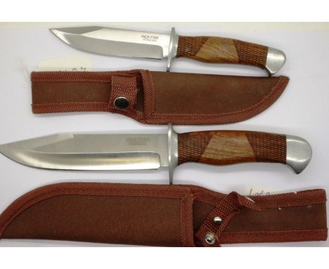 Two hunting knives by Jack Pyke, each with walnut grips and leather sheathes. P&amp;P Group 3 (£25+VAT for the first lot and 