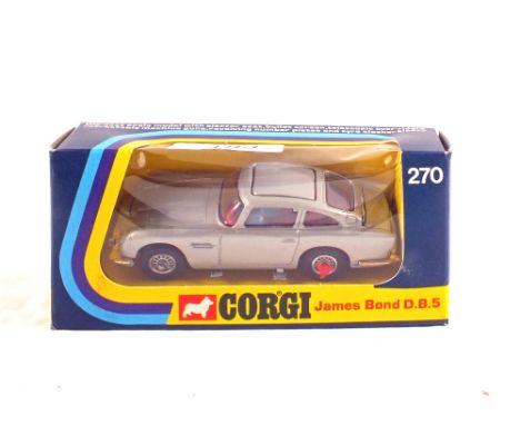 A Corgi Toys 270 James Bond Aston martin DB5, Silver body, red interior, revolving number plate, extending tyre slashes and e