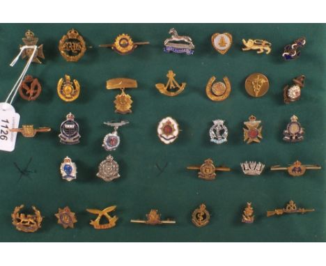 A display of military sweetheart brooches including Highland Light Infantry