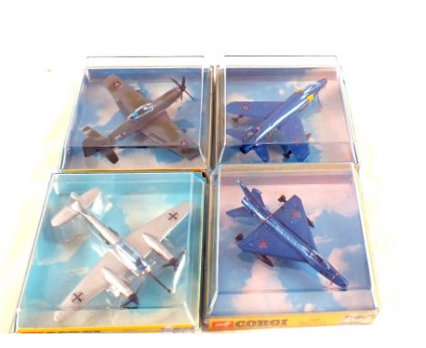 A boxed Corgi 1306 P51D Mustang, 1304 MIG 21 PF/1305 Gruman FIIA tiger (dark blue with yellow engine vents), 1311 Messerschmi