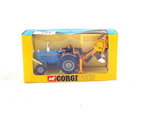 A Corgi Toys 72 Ford 5000 super major tractor with trenching bucket, in window box