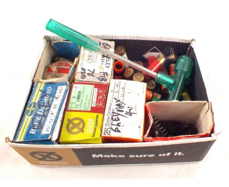 A quantity of 12 bore cartridges with a box of brushes, a bullet puller and a box containing 8mm blanks, this item can only b