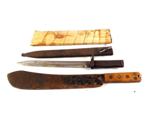 A German WWI Ersatz bayonet with a scabbard and a machete 