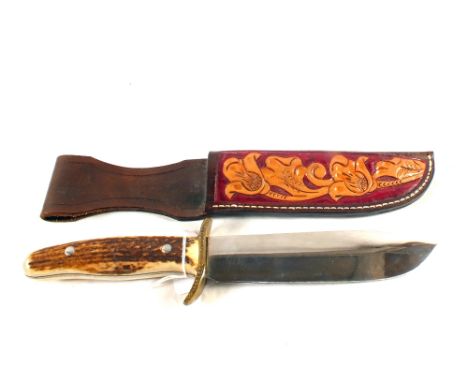 A 'rare' Wilkinson sword survival knife with stag scales to grip, within its tooled leather sheath