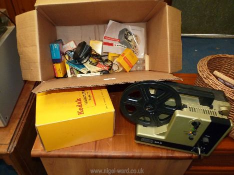 An Eumig 614 D cine projector, 8mm film reels, Kodak flash holder, etc.