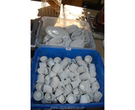 A large quantity of small milk jugs, sugar bowls, sauce boats and saucers for catering.