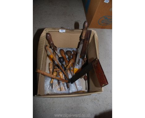 Box of wooden handled old tools.