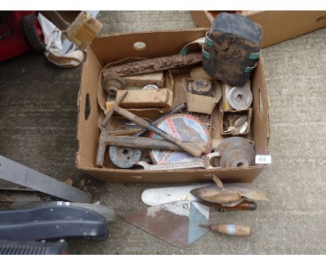 A box of mixed tools including. pointing trowels, belt drive wheels, hammers and picks etc.