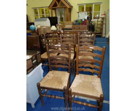 A set of 8 seagrass seated ladder back dining chairs.