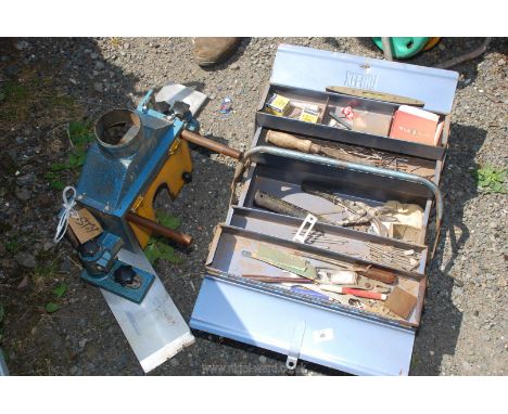 A metal toolbox and contents and metal guard