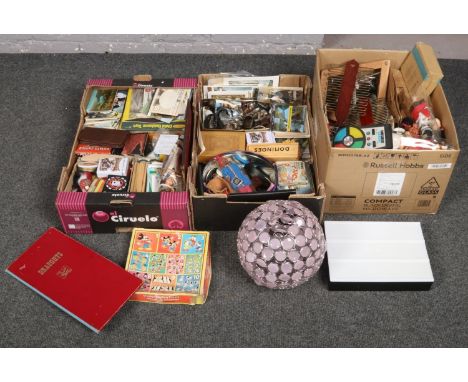 Three boxes of miscellaneous to include games, tins, postcards, dolls, light shade, badges etc.  
