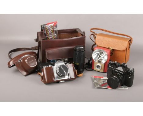 A collection of vintage cameras,  Asahi Pentax S1 with Helios 200 mm lens and flash 38mm in bag, Zenit 12 xp, Brownie Starfla