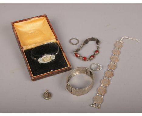 A collection of silver jewellery to include wristwatch, bangle, coin bracelet etc.  