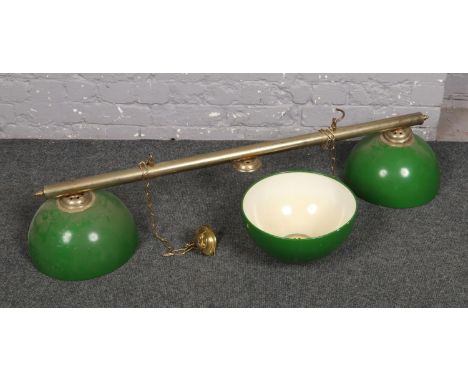 A set of vintage metal pool table lights, with three enamel shades.  