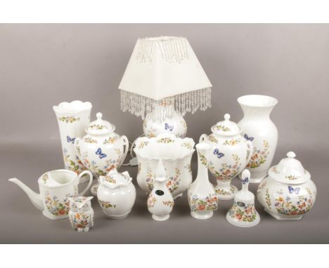 A collection of Aynsley Cottage Garden bone china, to include table lamp, lidded urns etc.  