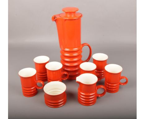 A 1970's Carltonware coffee set, with orange glaze and banded decoration.  Good condition.