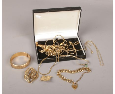 A collection of gold plated costume jewellery, necklaces, brooches, bangle, stamped Grosse, Monet, Giovanni etc  