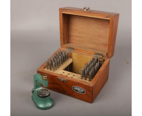 A wooden cased set of Dracip watch maker's tools.  