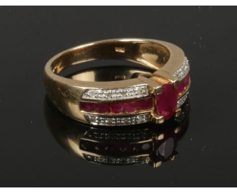 A 9ct gold, ruby and diamond St George cross ring. Gross weight 4.8 grams, Size Q.  