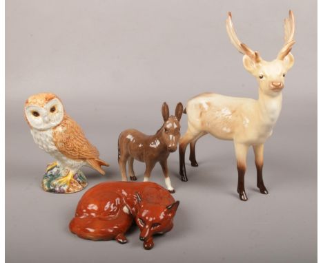 Four Beswick ceramic figures, to include stag deer, fox, owl and donkey.  Good condition.