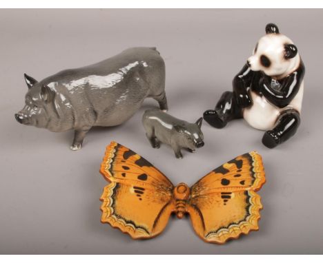 A group of ceramic animals, to include Royal Doulton pigs, Beswick Large Tortoiseshell butterfly and a panda.  Tortoiseshell 