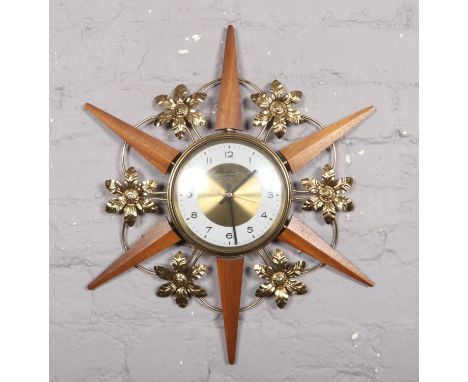 A vintage Bentima sunburst wall clock.  